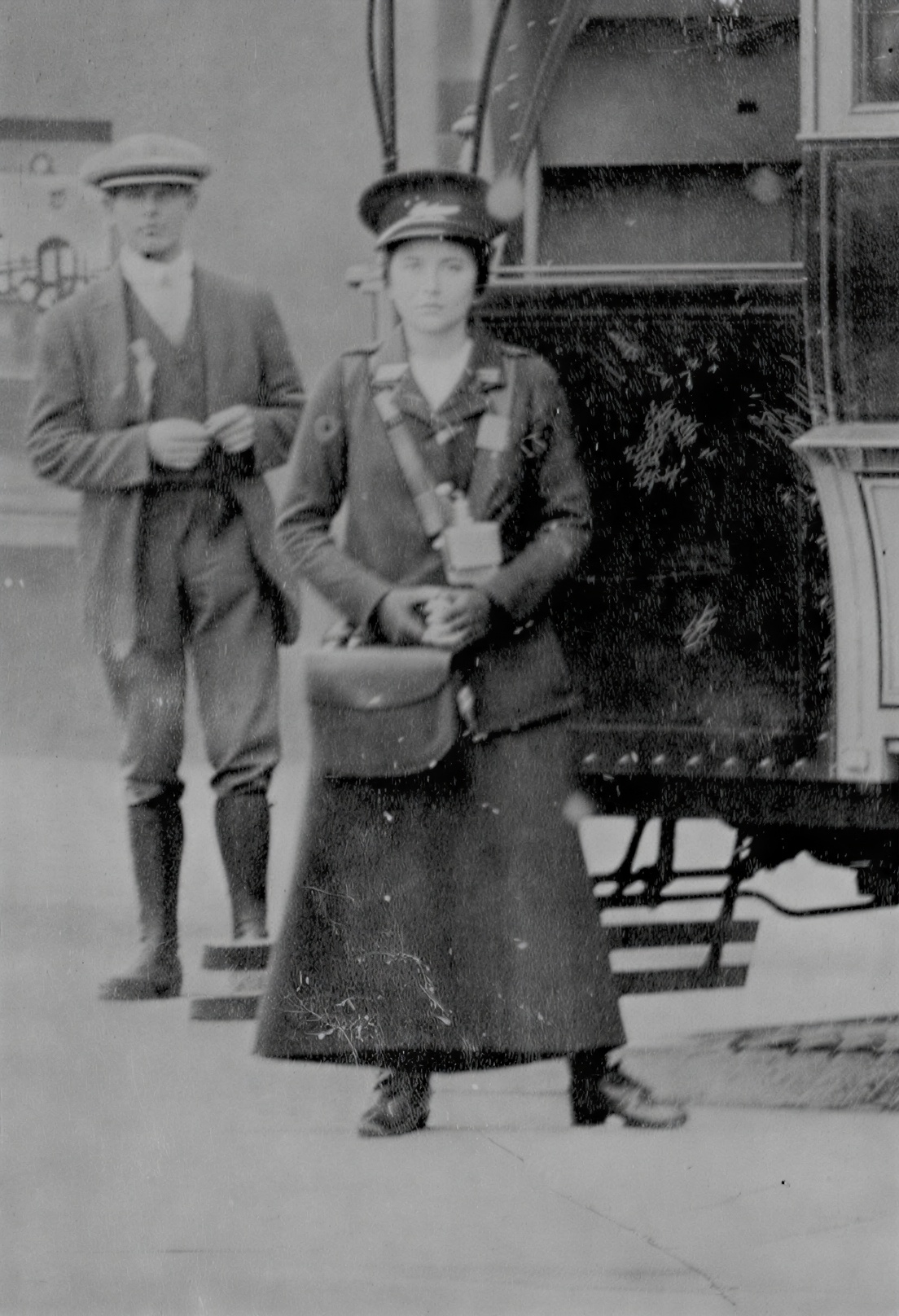 Brighton tram conductress beside a tram